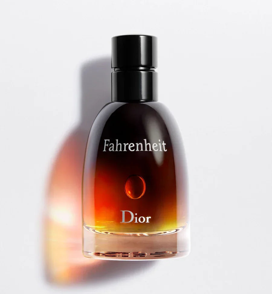 Dior Fahrenheit perfume bottle with amber gradient liquid and black cap, luxury men's fragrance