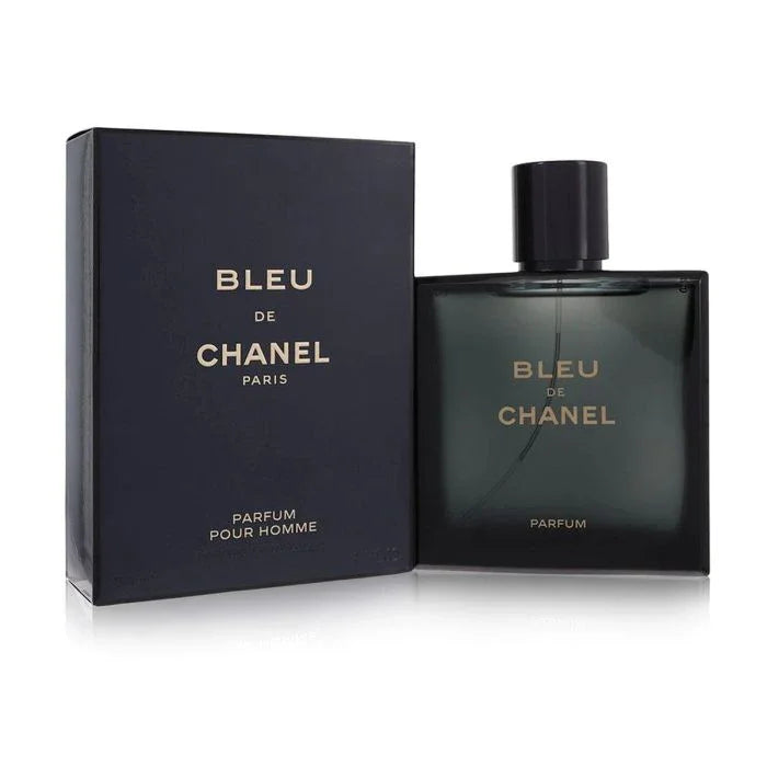 A bottle of Chanel Bleu de Chanel Parfum next to its black packaging box.