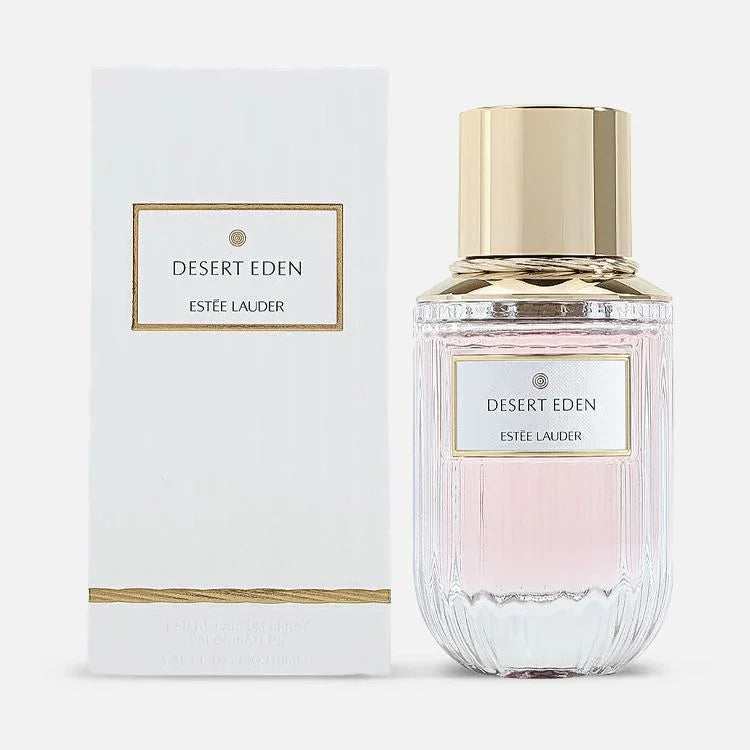 Estée Lauder Desert Eden perfume bottle with gold cap and white box, pink fragrance liquid visible