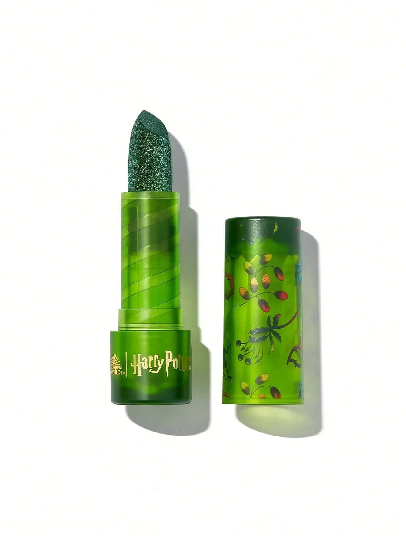 Harry Potter green glitter lipstick with botanical design, perfect for magical makeup looks