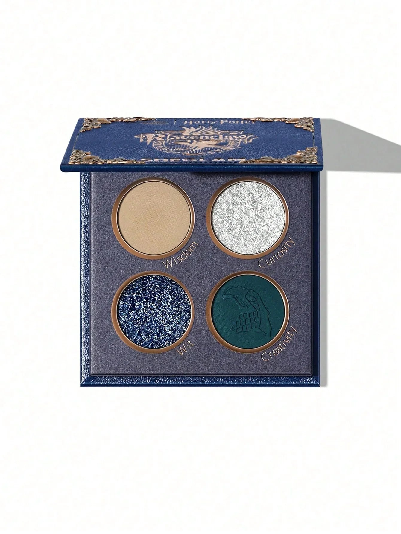 Harry Potter Ravenclaw eyeshadow palette with Wisdom, Curiosity, Wit, Creativity shades in blue and silver tones