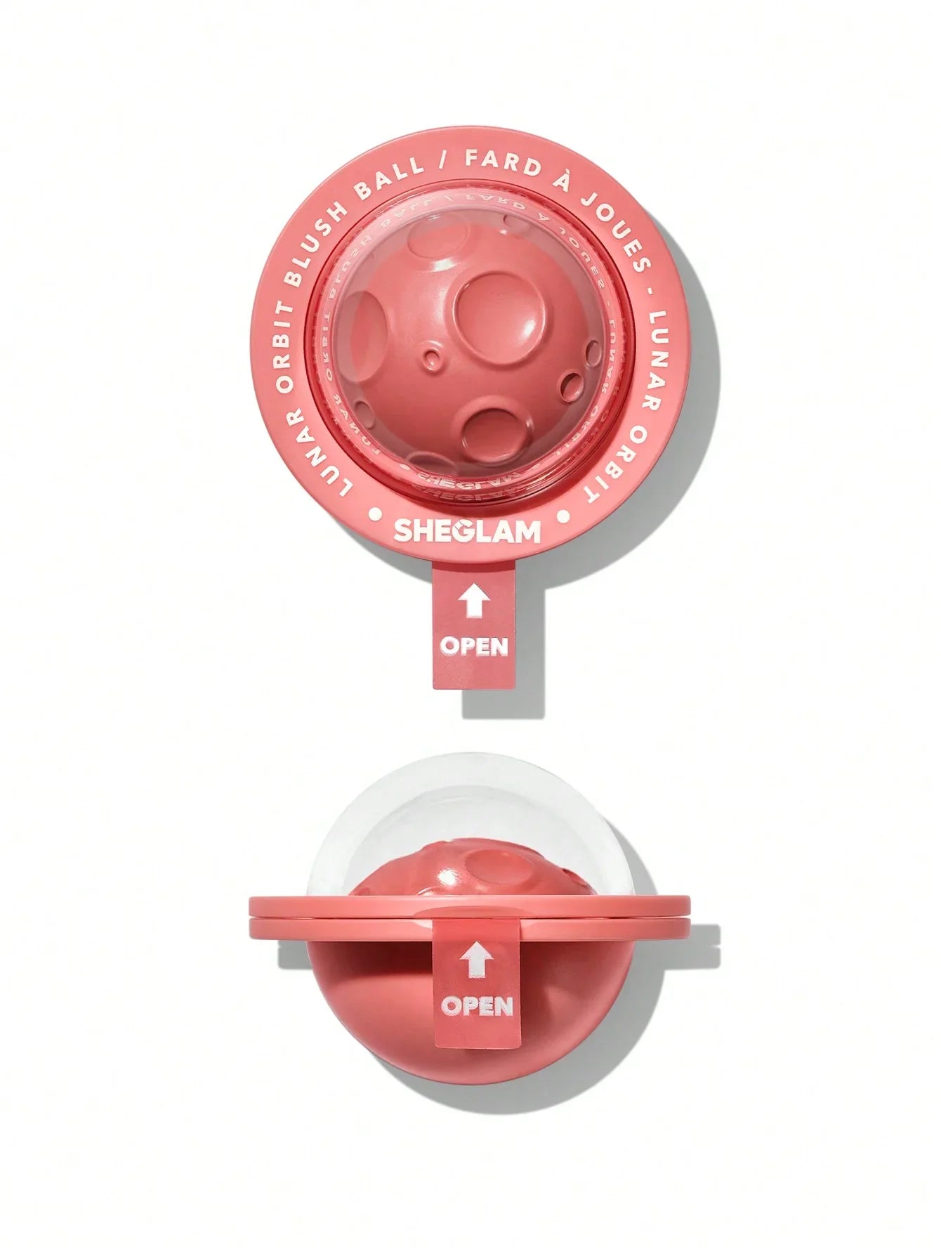 Sheglam Lunar Orbit Blush Ball in coral pink, round compact with textured surface and open lid