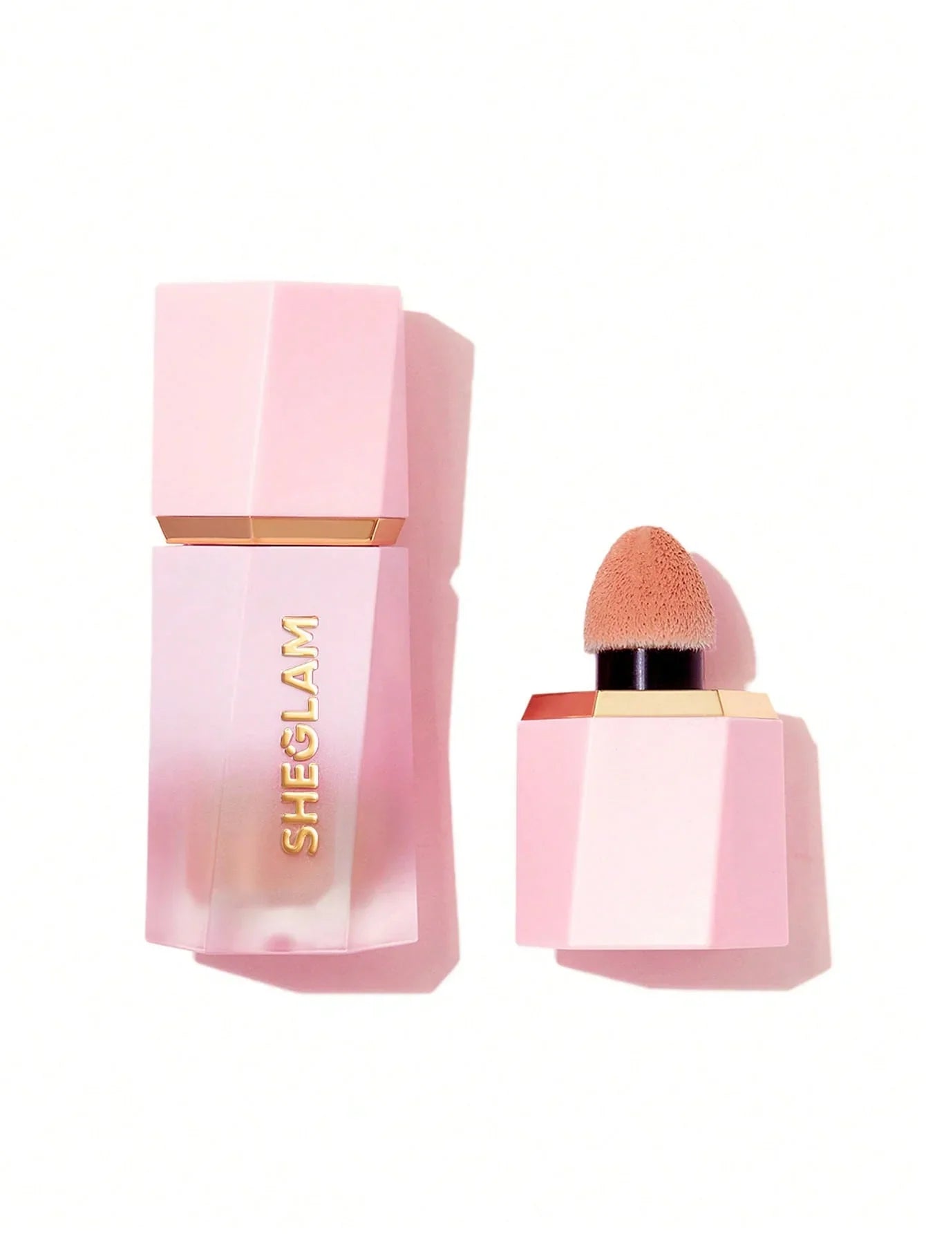 Sheglam liquid foundation with sponge applicator in pink geometric bottle, beauty makeup product