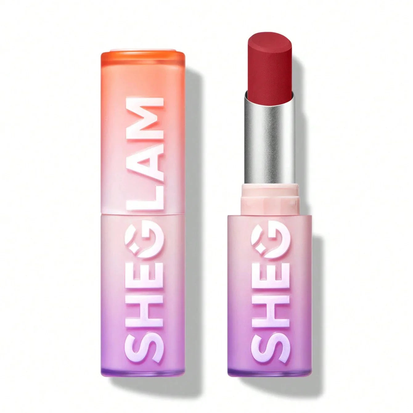 Sheglam matte lipstick in vibrant red shade with gradient pink-purple tube, perfect for bold makeup looks.