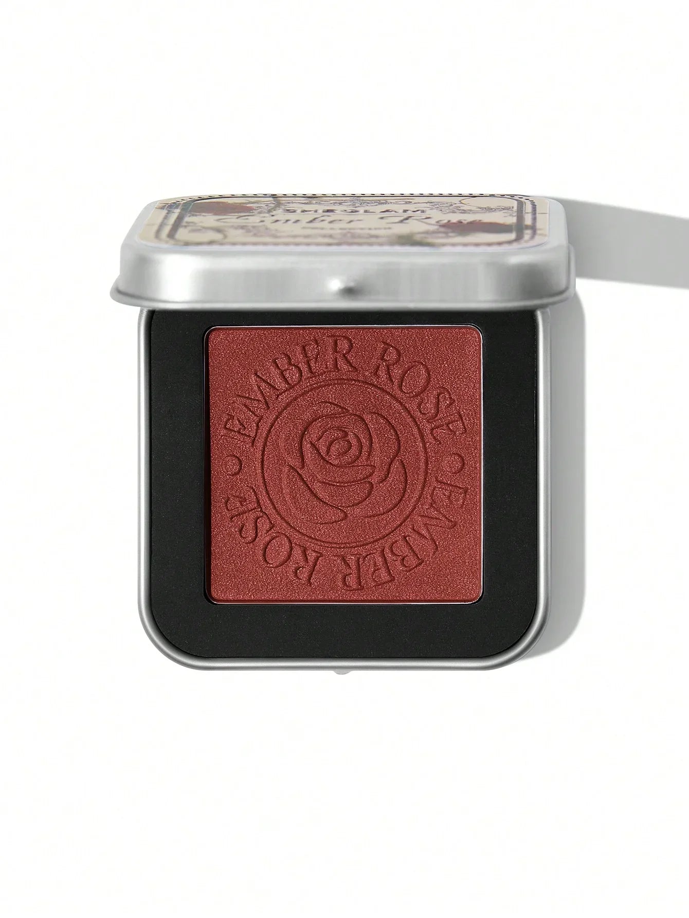 Ember Rose blush with rose design in sleek tin packaging