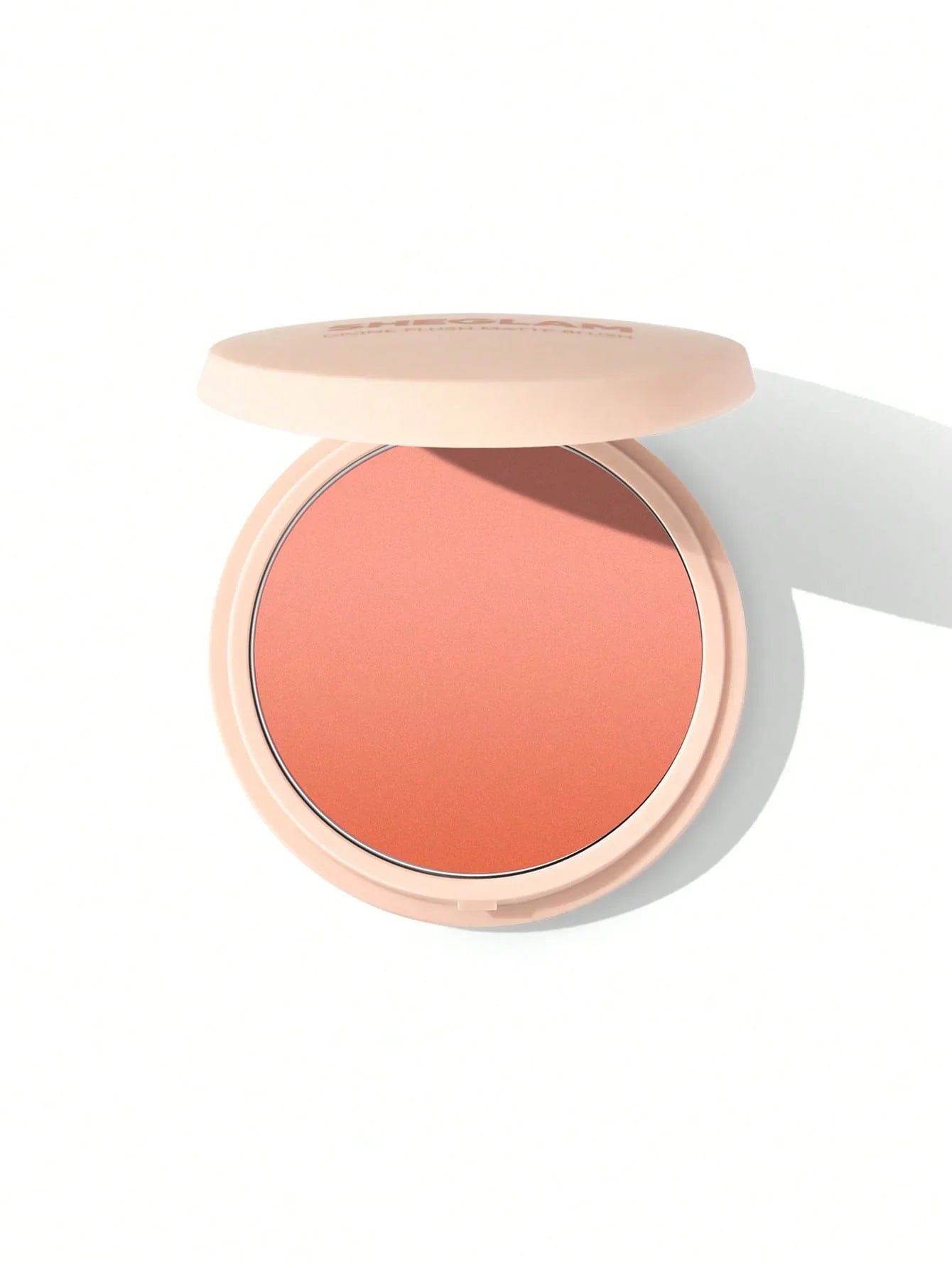 Sheglam Divine Flush Matte Blush in coral shade, open compact on white background