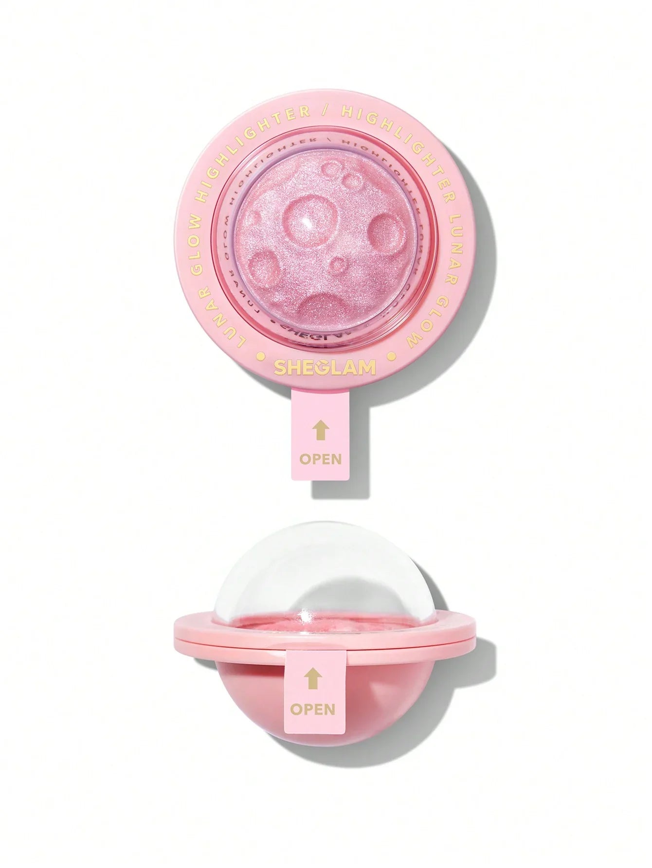 Sheglam Lunar Glow Highlighter in pink, featuring moon crater design and open compact for radiant makeup glow