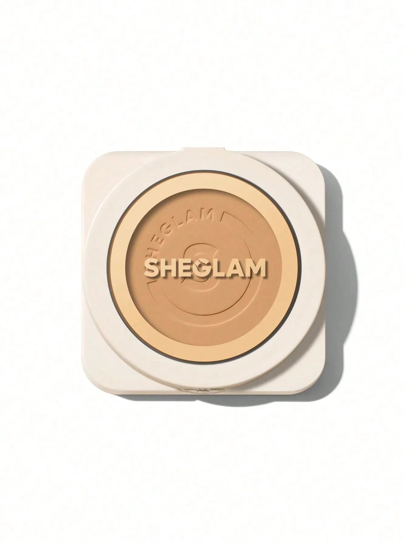 Sheglam pressed powder compact with beige tone, ideal for flawless makeup finish