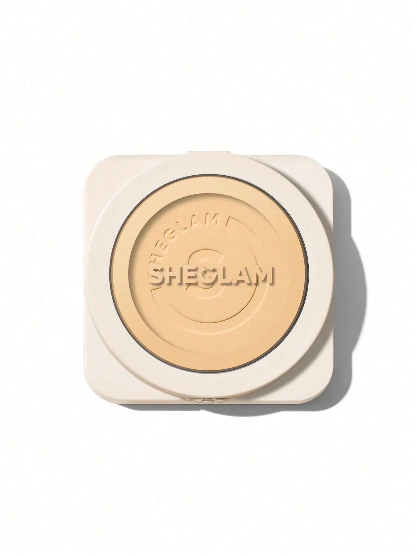 Sheglam pressed powder compact with embossed logo, natural beige tone for flawless makeup finish