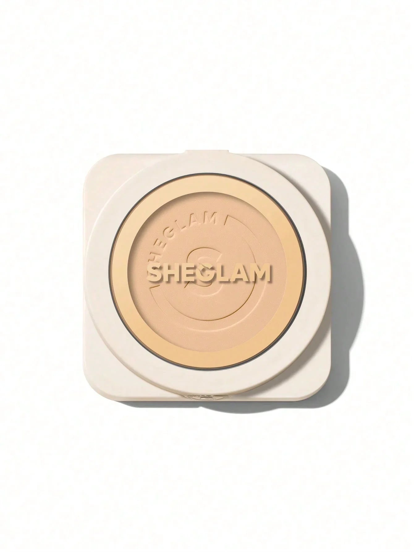 SHEGLAM pressed powder compact with beige tone, ideal for flawless makeup finish