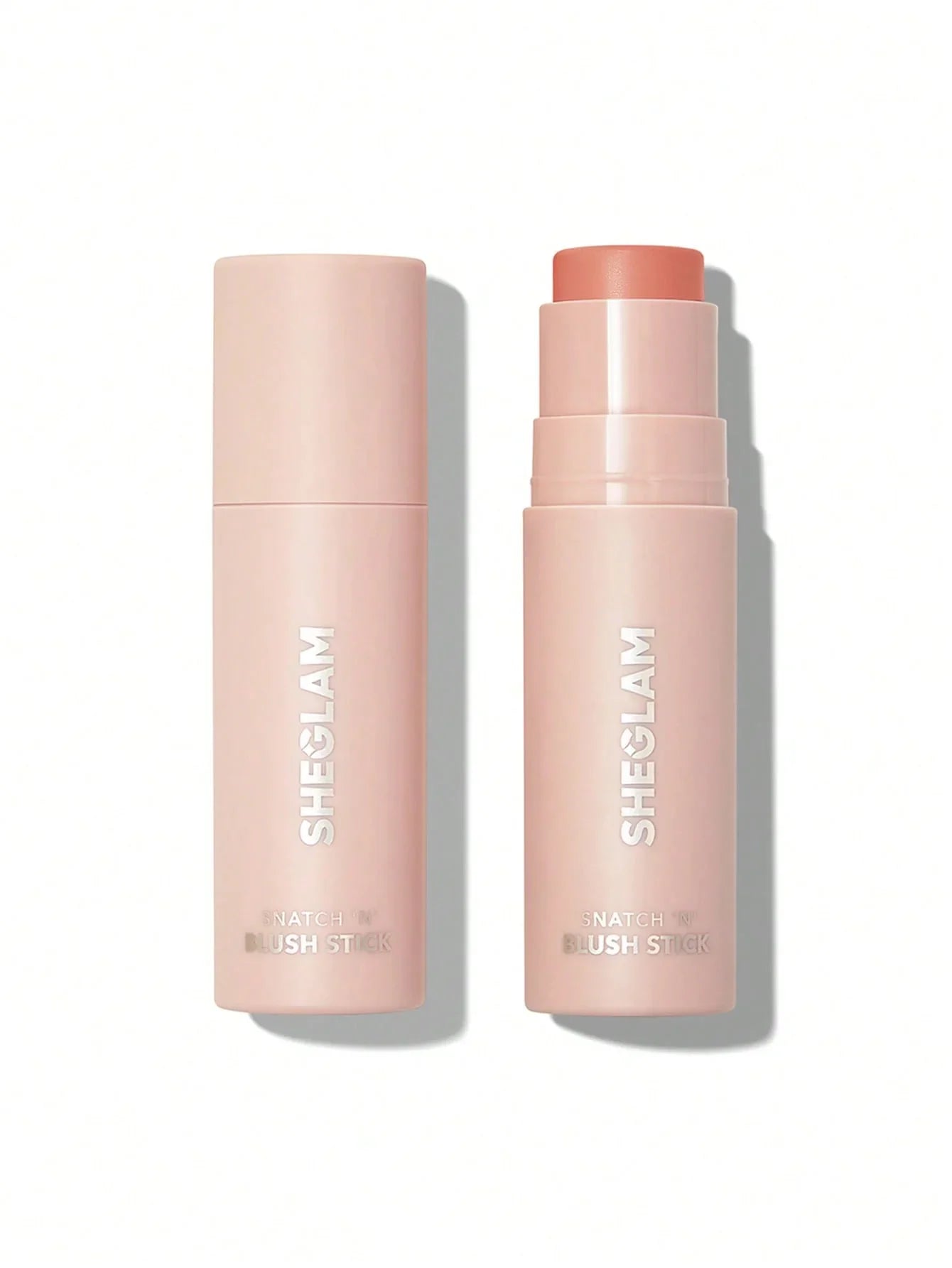 SHEGLAM Snatch 'N' Blush Stick in soft pink packaging, open and closed view for beauty makeup application.