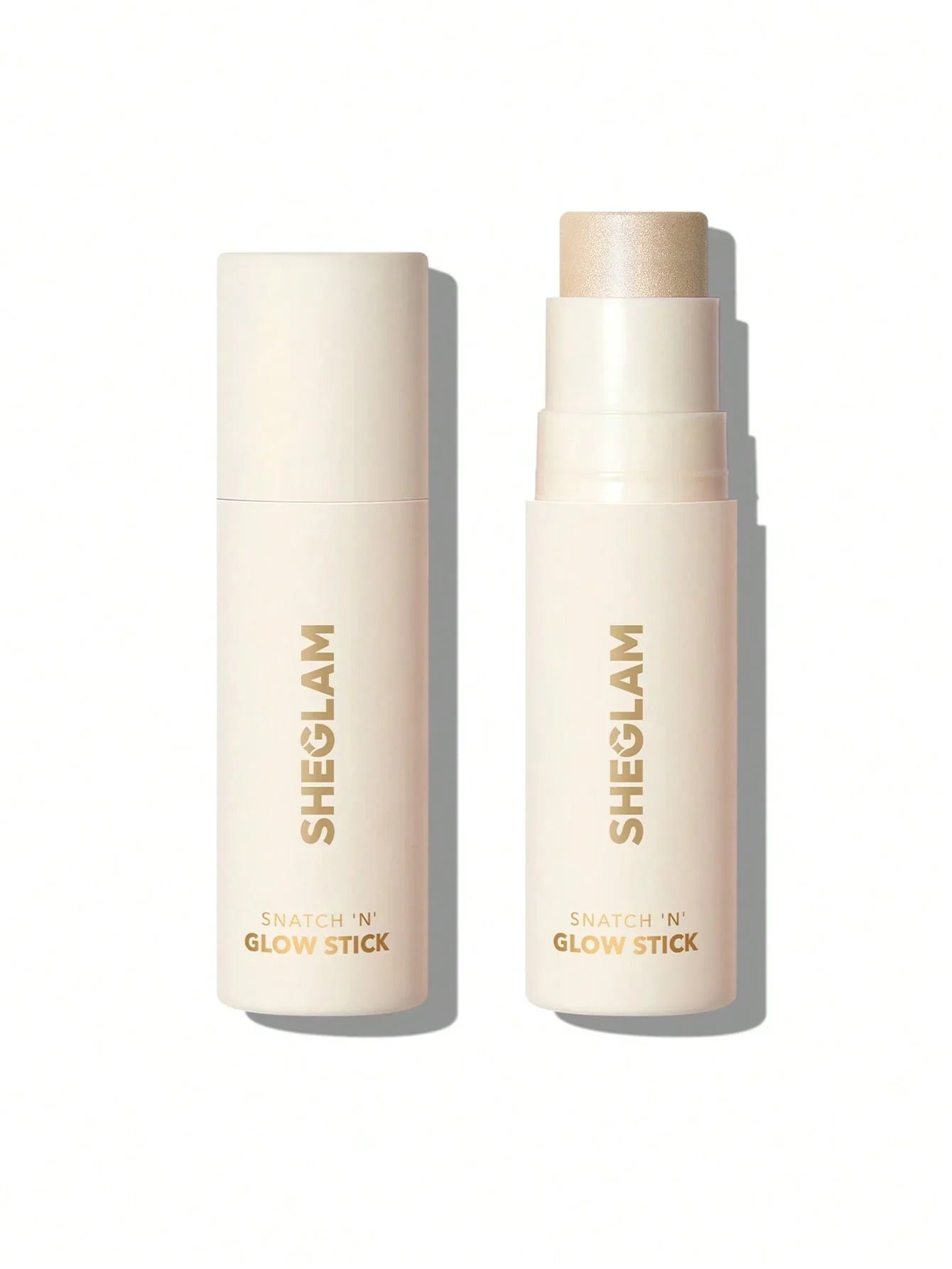Sheglam Snatch 'N' Glow Stick highlighter in creamy beige tube with shimmering gold glow