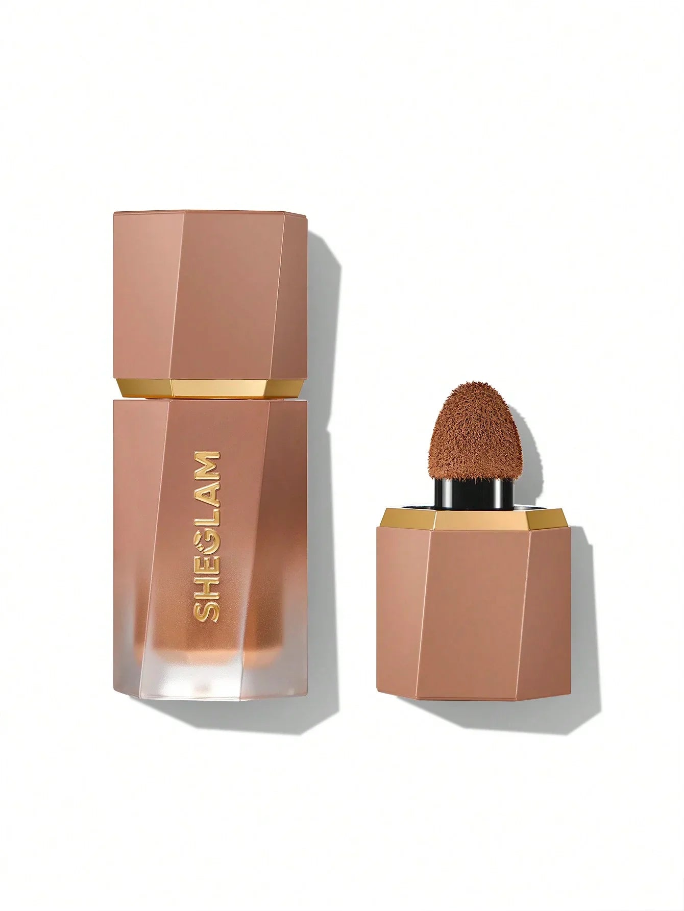 Sheglam liquid foundation with sponge applicator, sleek rose gold bottle, beauty makeup product
